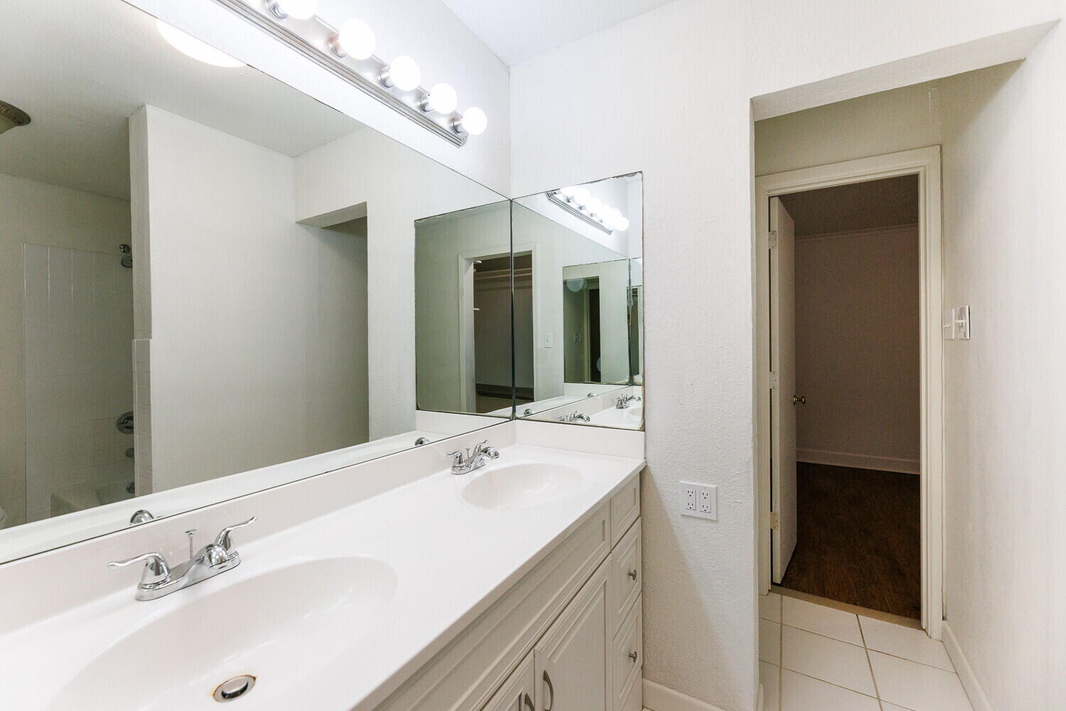 4714 46th Street Lubbock, TX 79414 - Photo 30 of 57 a bathroom with a sink and a mirror