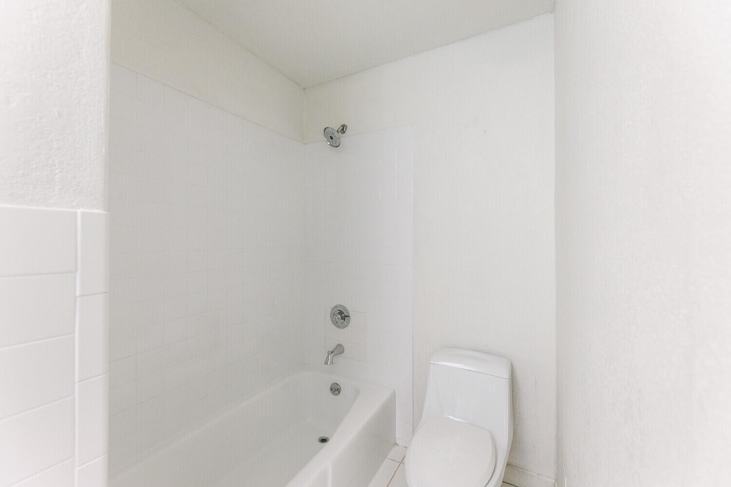 4714 46th Street Lubbock, TX 79414 - Photo 32 of 57 a bathroom with a toilet and bathtub