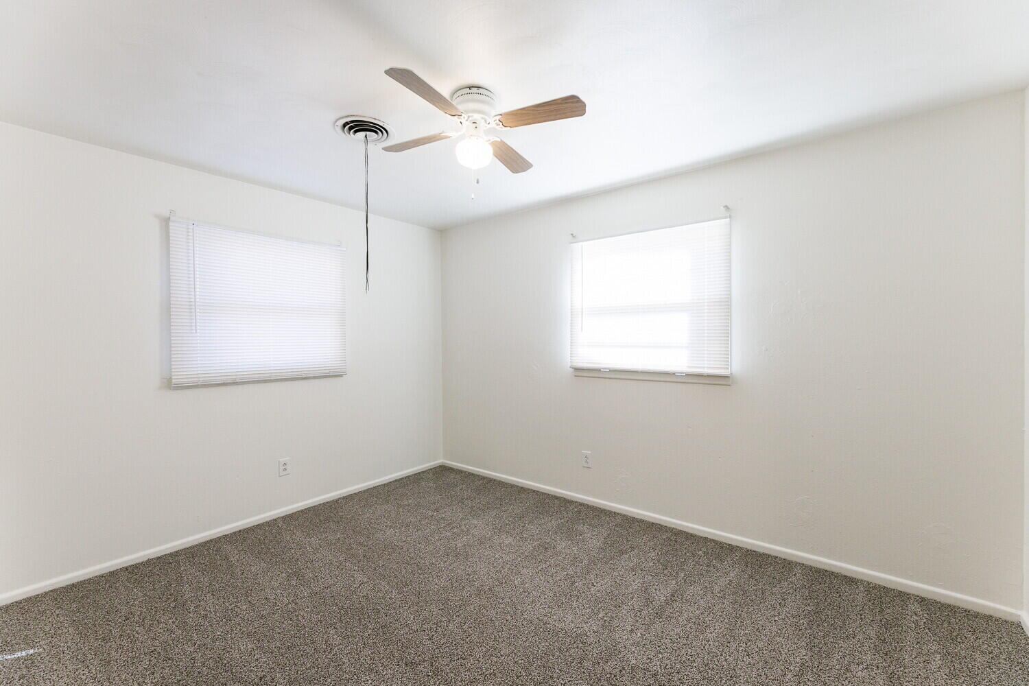 4714 46th Street Lubbock, TX 79414 - Photo 44 of 57 an empty room with a window and a fan