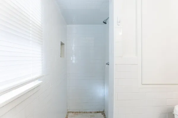 a bathroom with a bathtub and toilet