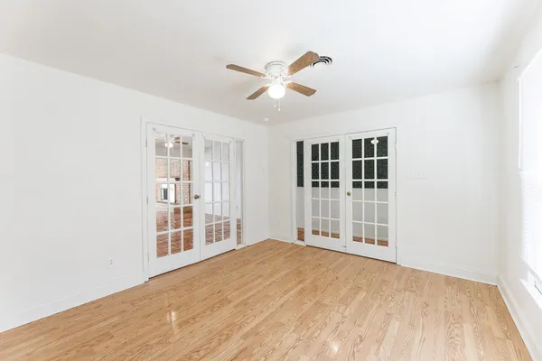 a view of walk in closet with empty racks