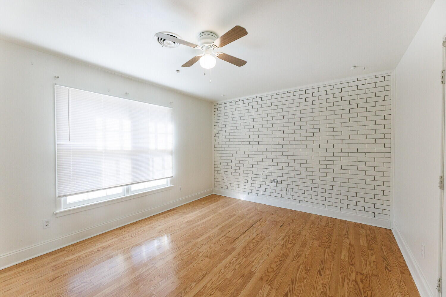 4714 46th Street Lubbock, TX 79414 - Photo 8 of 57 wooden floor in an empty room with a window