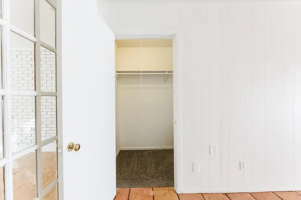 a view of a kitchen with wooden floor and a kitchen