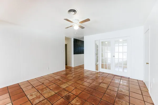a view of an empty room with a fireplace
