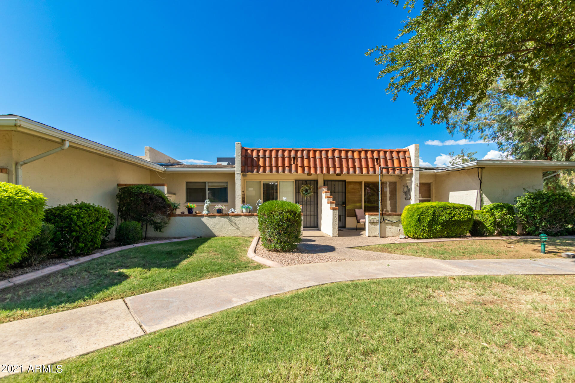 625 South Power Road, Unit 351 Mesa, AZ 85206 - Photo 7 of 31 a view of a house with a yard and potted plants