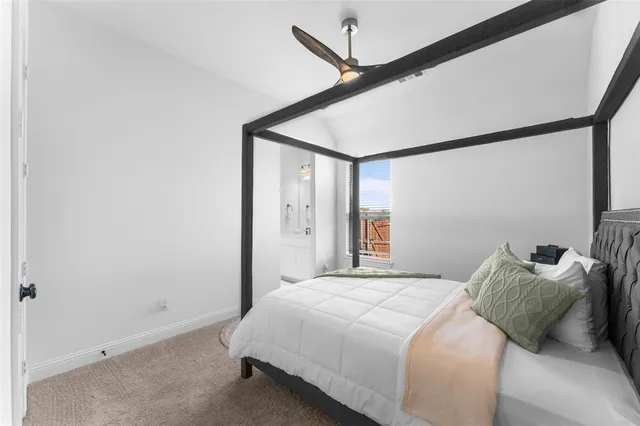 a bedroom with bed and a window