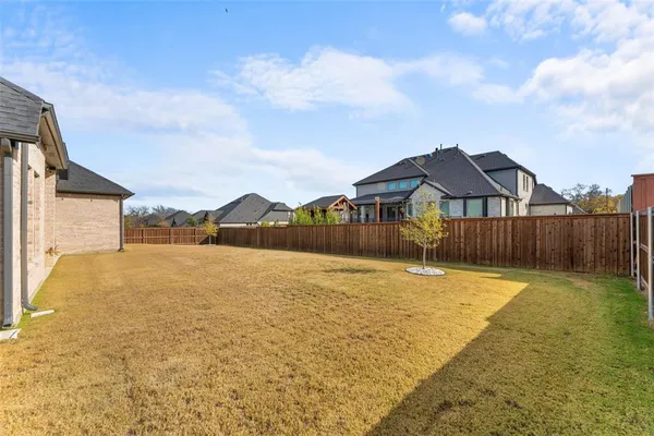 a view of a houses with a yard