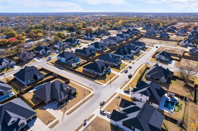 an aerial view of a city with lots of residential buildings