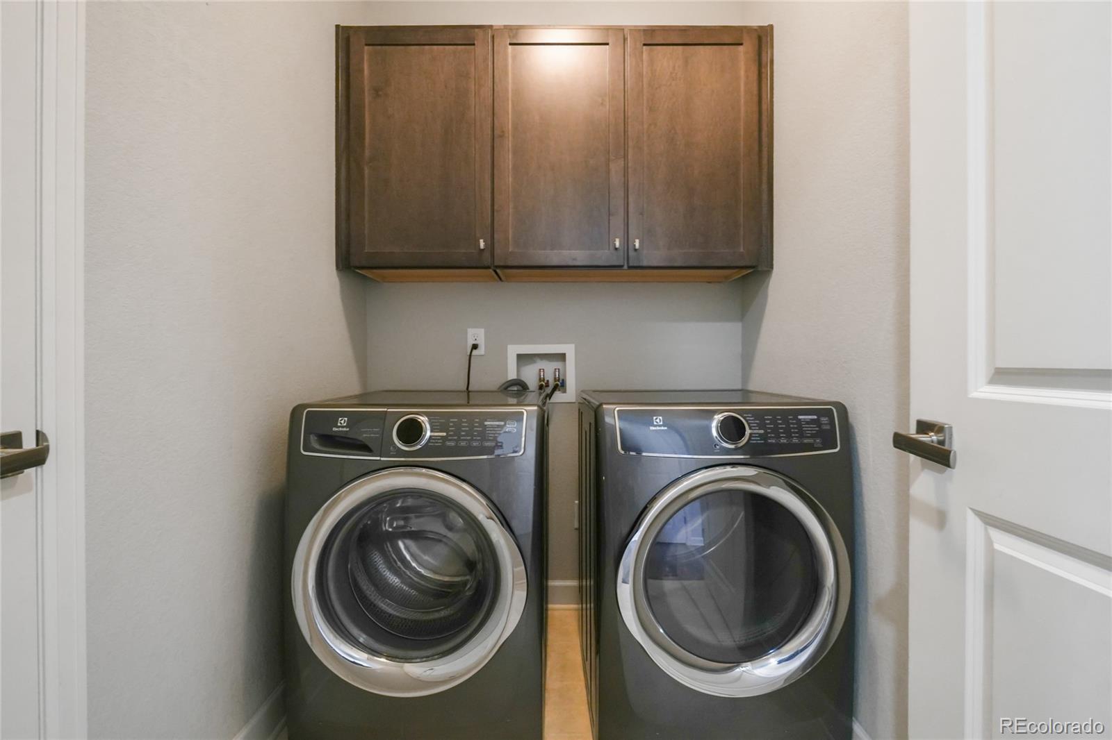 6523 Independence Street Frederick, CO 80516 - Photo 13 of 21 a utility room with dryer and washer