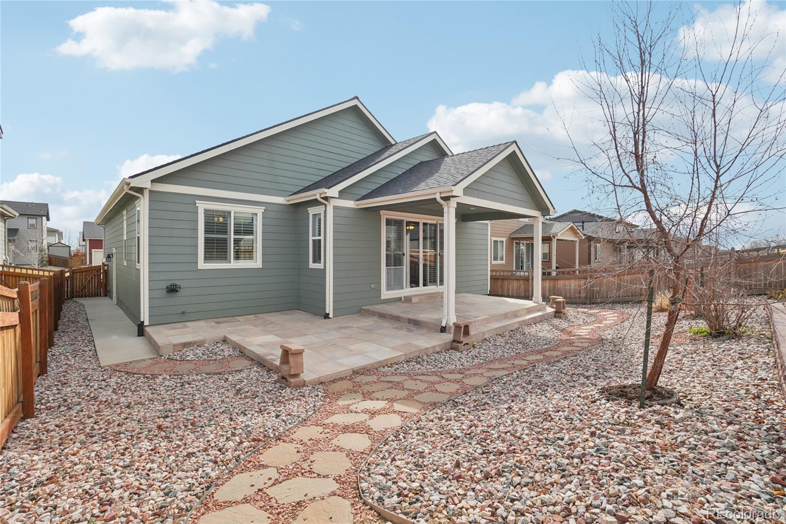 6523 Independence Street Frederick, CO 80516 - Photo 16 of 21 a house that has a tree in front of it
