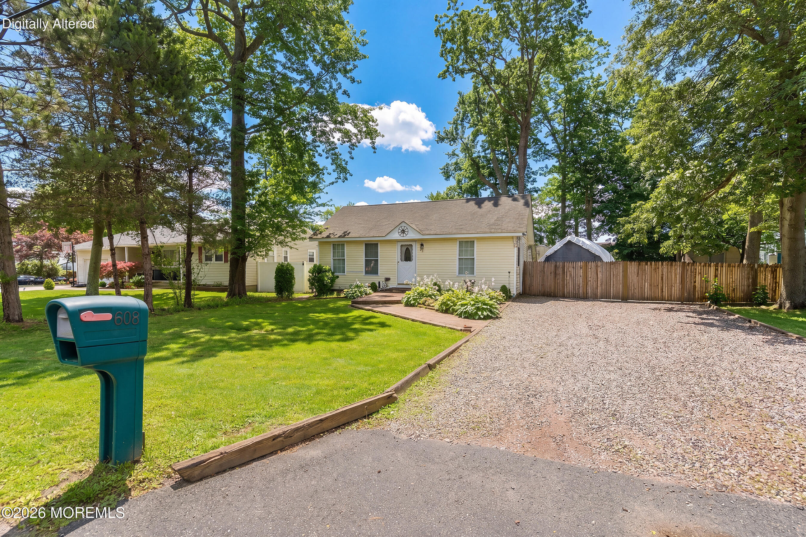 608 Holly Boulevard Bayville, NJ 08721 - Photo 2 of 8 a front view of a house with a yard