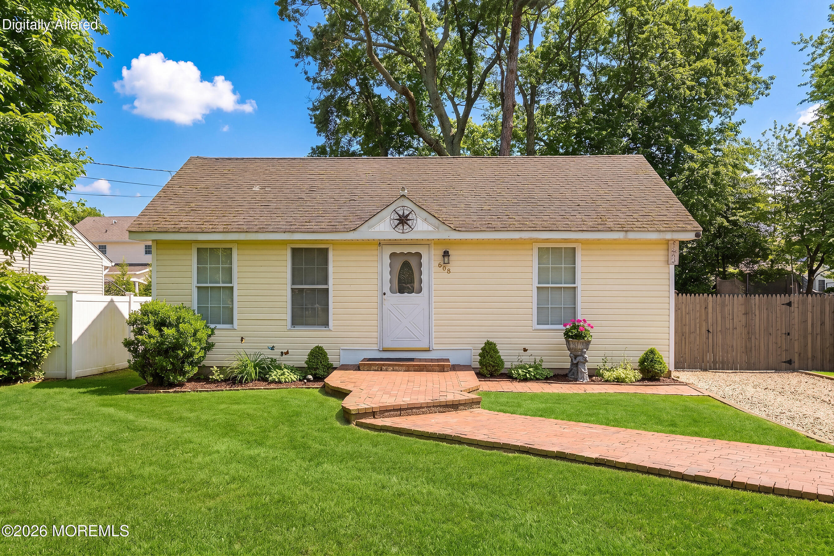608 Holly Boulevard Bayville, NJ 08721 - Photo 4 of 8 a view of a house with a yard and a garden