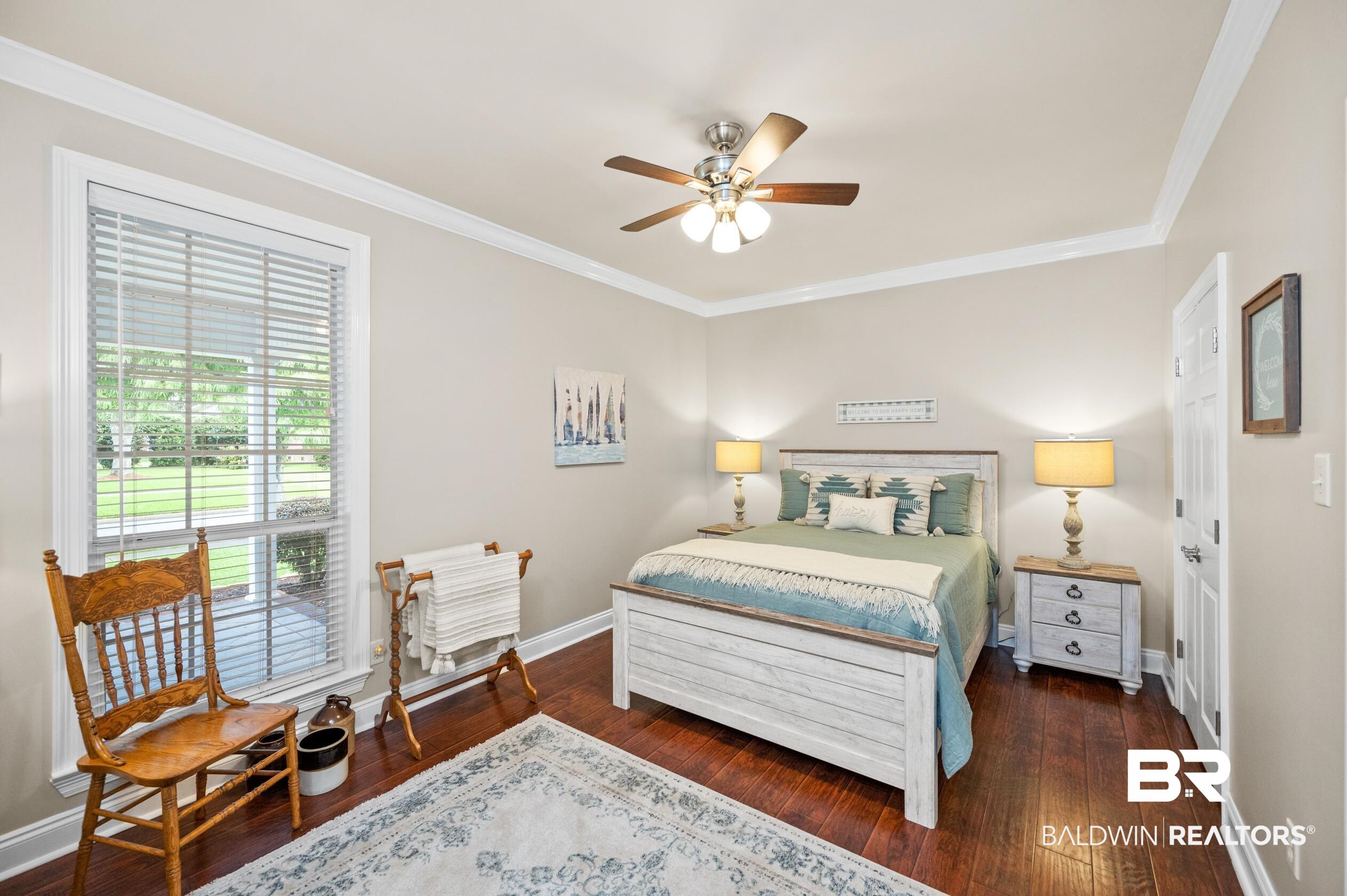 29614 St George Street Daphne, AL 36526 - Photo 27 of 42 Bedroom featuring dark hardwood / wood-style flooring, crown molding, and ceiling fan