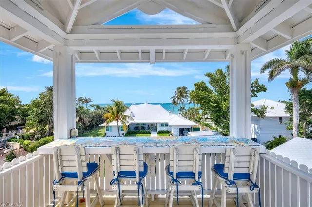 a view of an chairs and table in the balcony