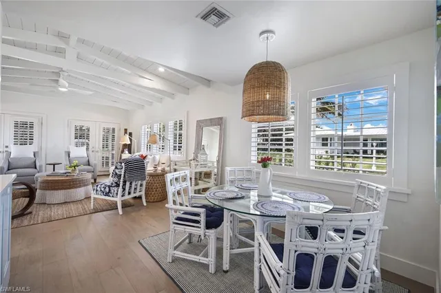 a view of a dining room with furniture window and outside view