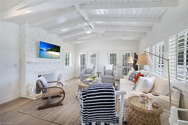 a bedroom with furniture and a flat screen tv