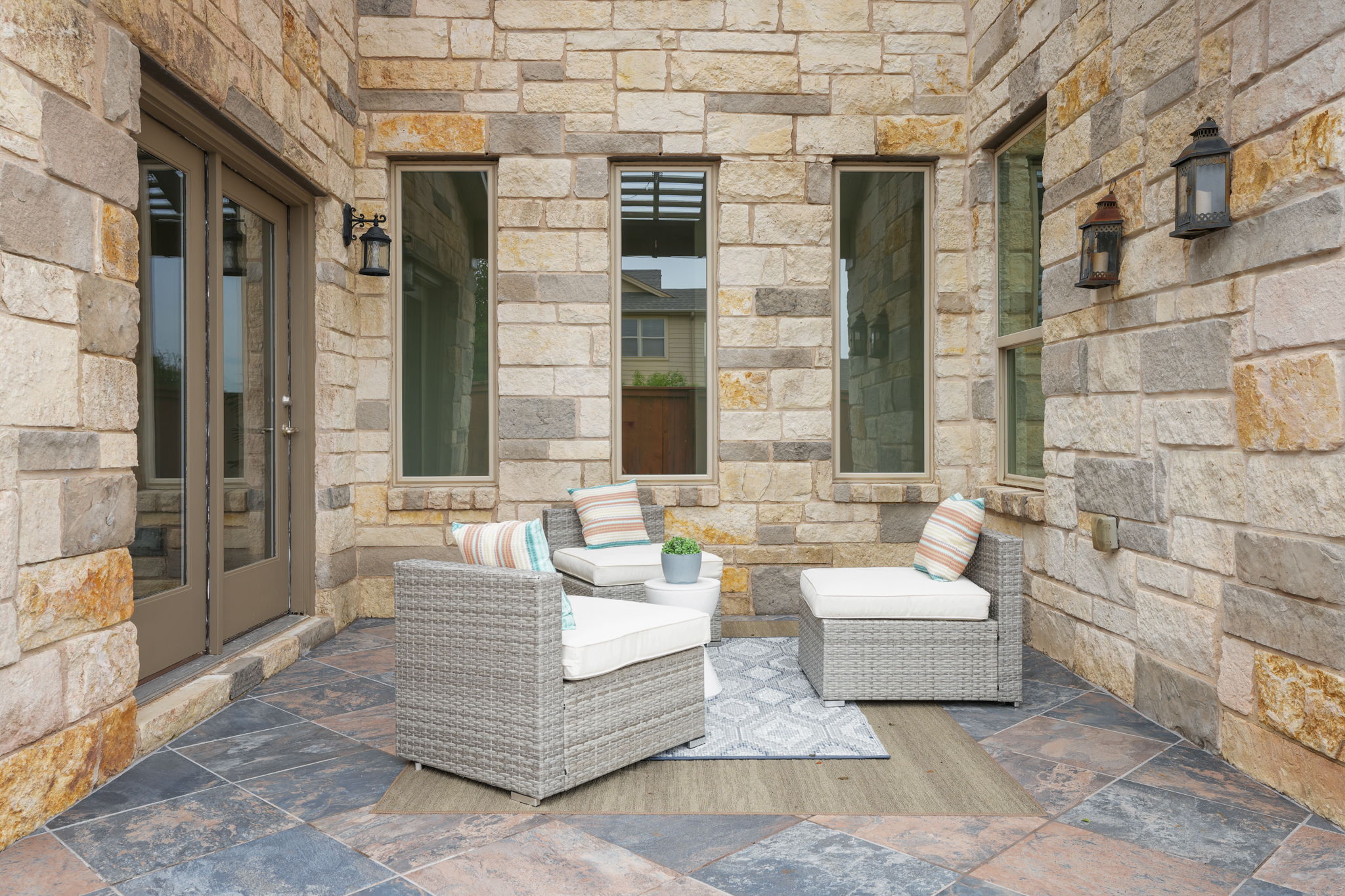 440 Cherokee Rose Circle Georgetown, TX 78626 - Photo 33 of 39 An inviting stone patio offers a cozy retreat for outdoor relaxation.