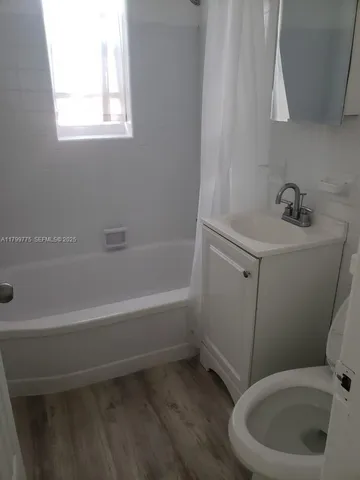 a bathroom with a sink and a bathtub