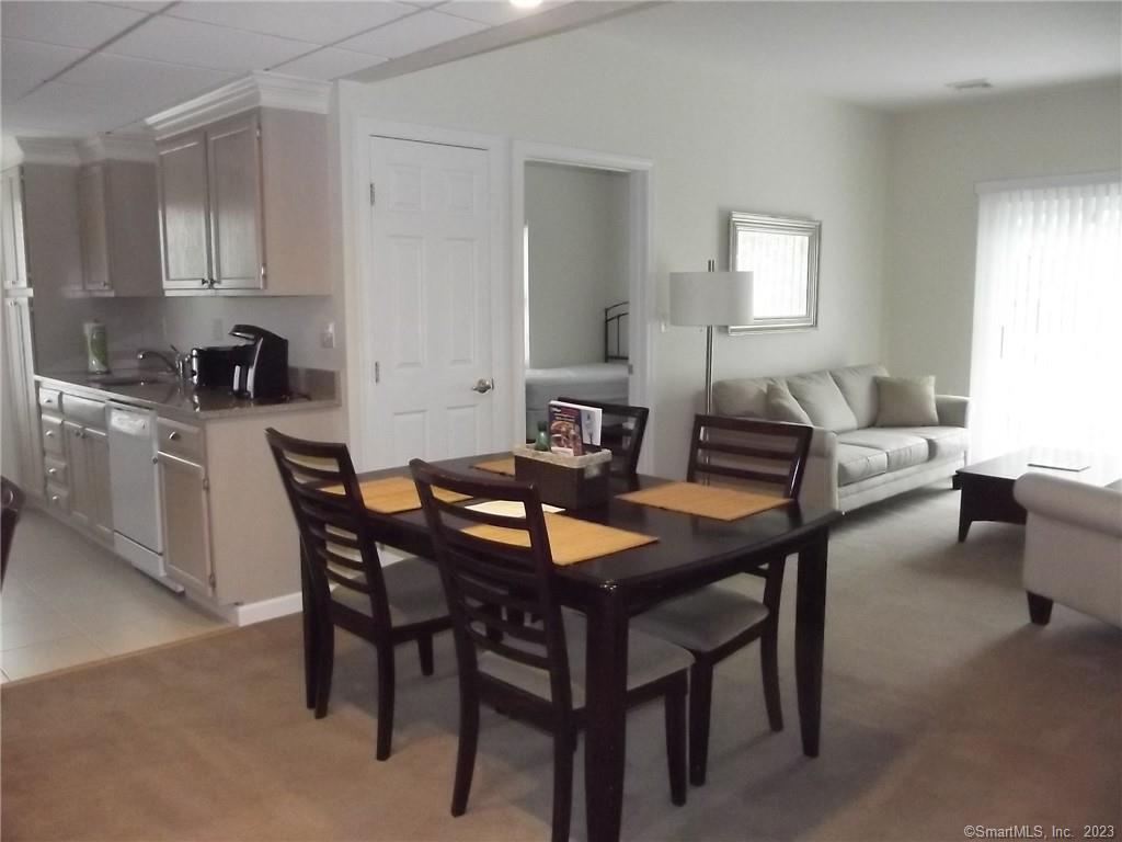 100 C Danbury Road, Unit 2E Ridgefield, CT 06877 - Photo 1 of 1 a view of a dining room with furniture