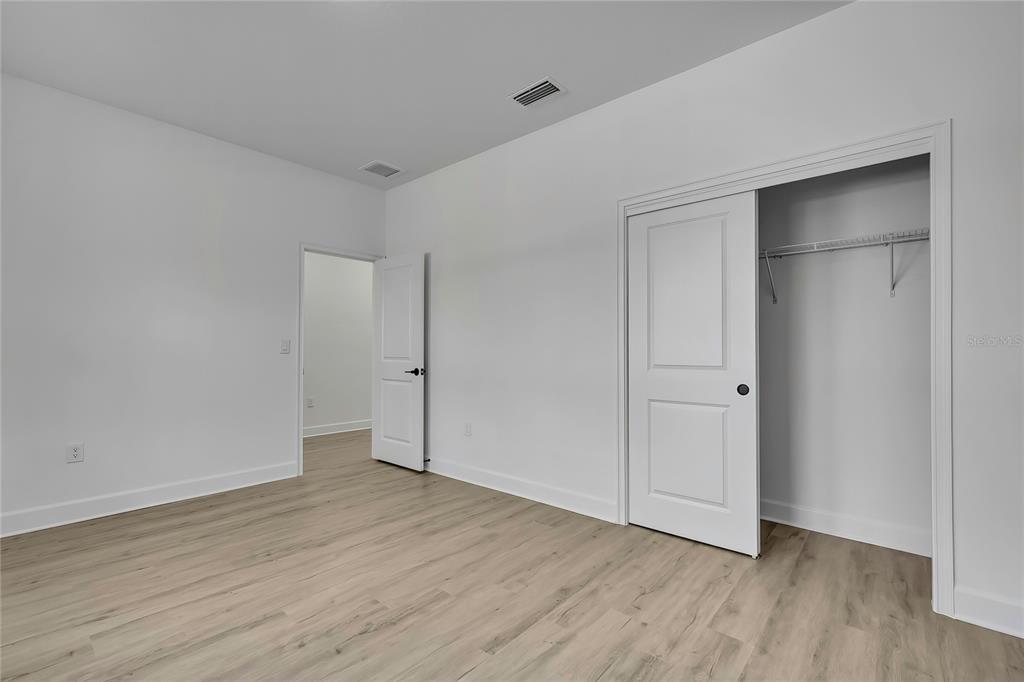 6513 Owl Road Weeki Wachee, FL 34613 - Photo 41 of 47 a view of an empty room with wooden floor
