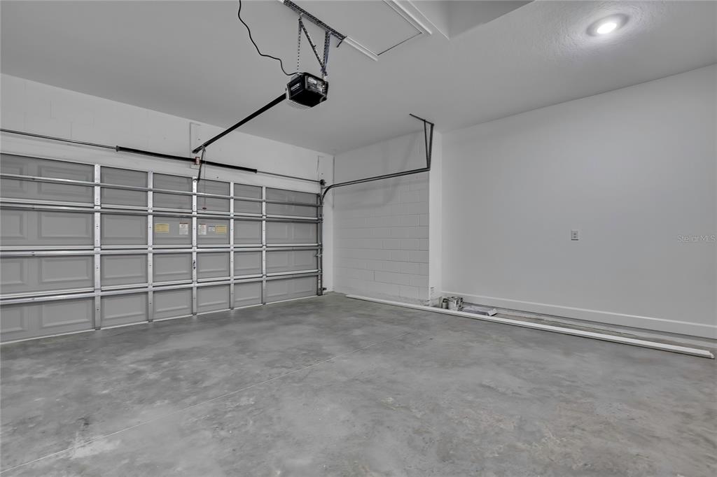 6513 Owl Road Weeki Wachee, FL 34613 - Photo 5 of 47 an empty room with a empty space and windows