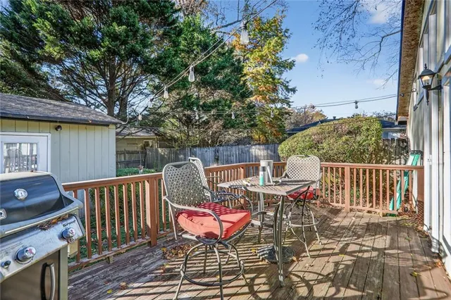 a view of a patio with iron fence