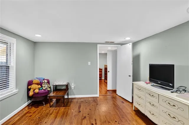 a room with furniture and wooden floor