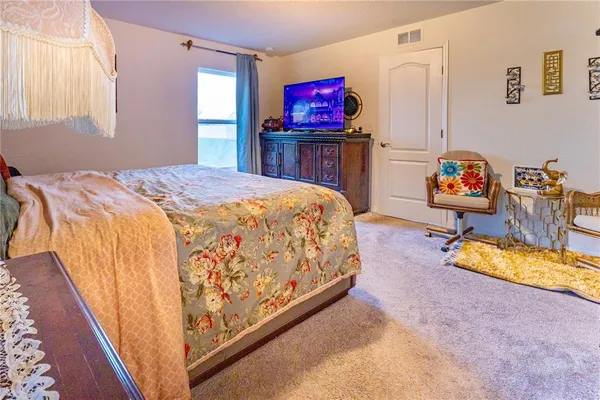 a bed room with a bed and a couch