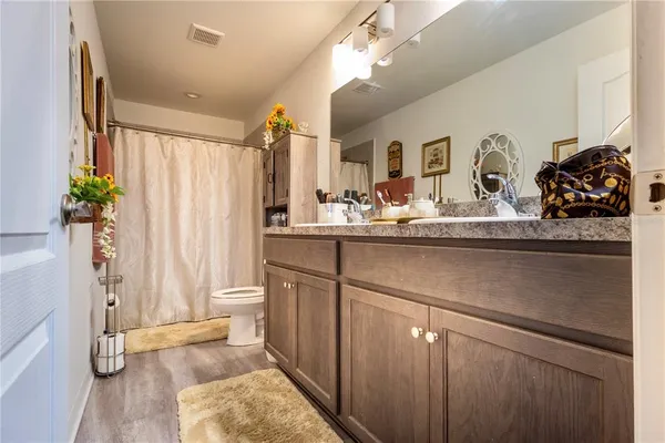 a bathroom with a sink a mirror and a shower