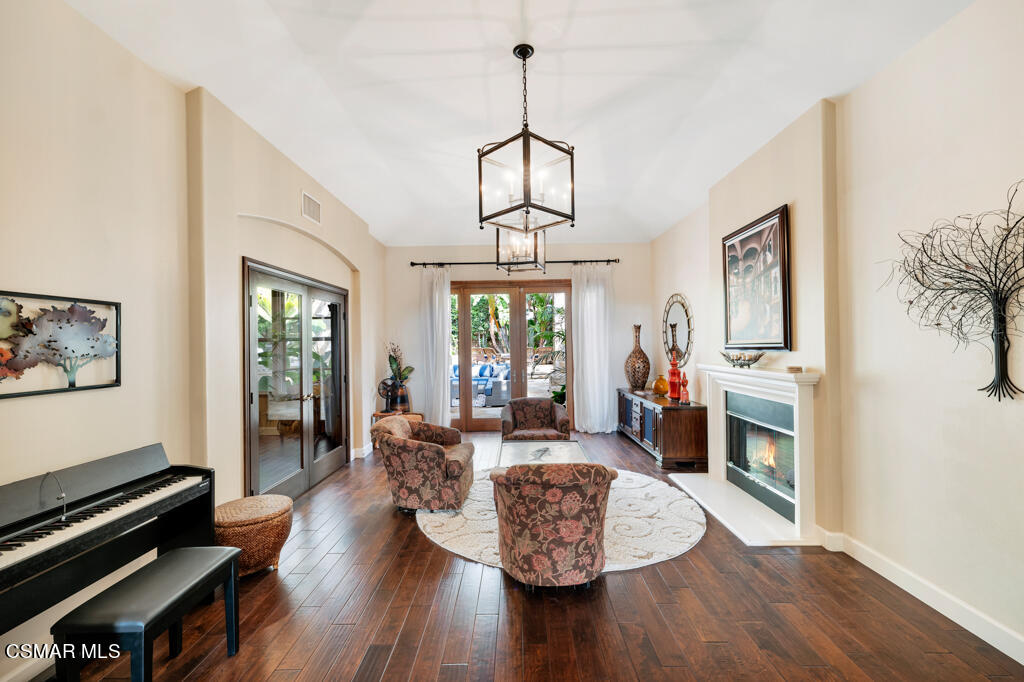 1776 Corte Jubilo Camarillo, CA 93012 - Photo 15 of 74 a living room with furniture fireplace and wooden floor
