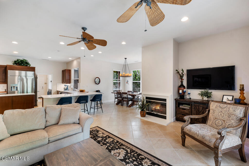 1776 Corte Jubilo Camarillo, CA 93012 - Photo 21 of 74 a living room with furniture kitchen view and a fireplace