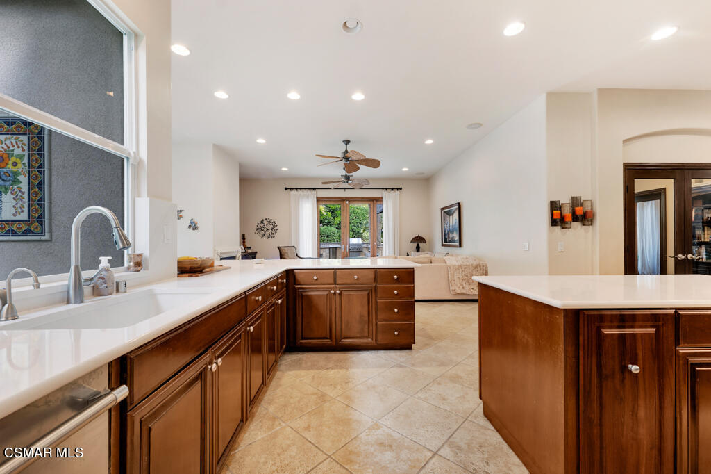 1776 Corte Jubilo Camarillo, CA 93012 - Photo 25 of 74 a large kitchen with kitchen island a sink a counter space and stainless steel appliances
