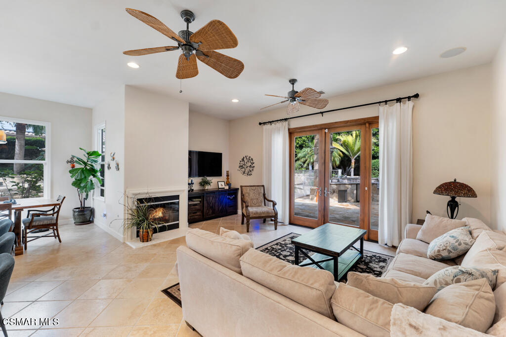 1776 Corte Jubilo Camarillo, CA 93012 - Photo 28 of 74 a living room with furniture ceiling fan and a fireplace