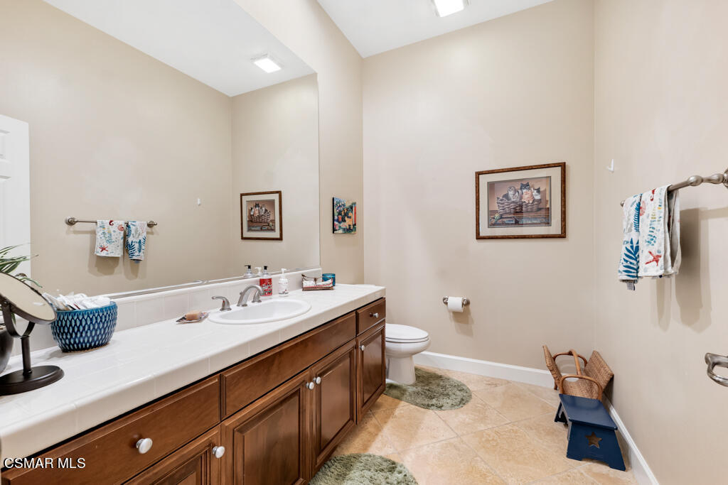 1776 Corte Jubilo Camarillo, CA 93012 - Photo 30 of 74 a bathroom with a sink mirror and toilet