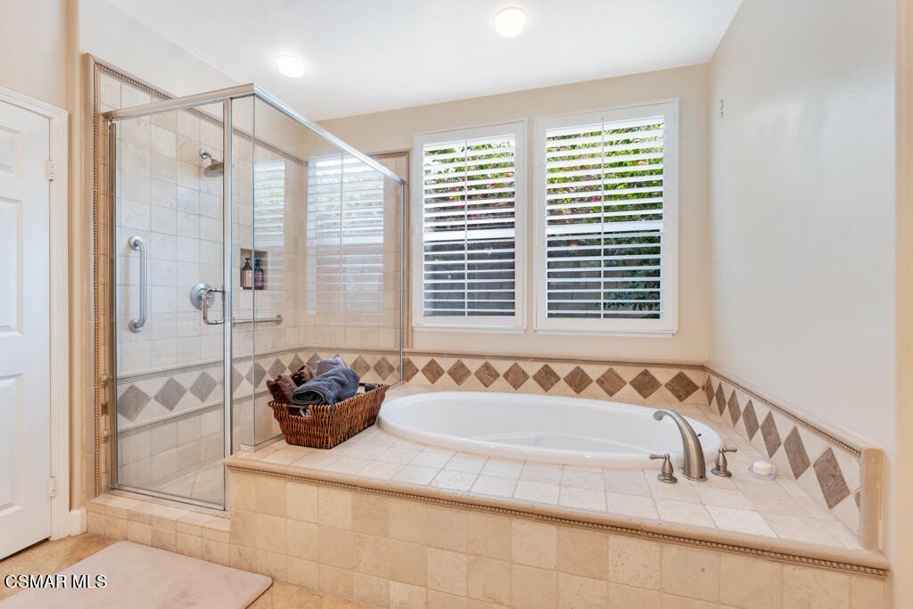1776 Corte Jubilo Camarillo, CA 93012 - Photo 36 of 74 a bathroom with a tub sink and mirror