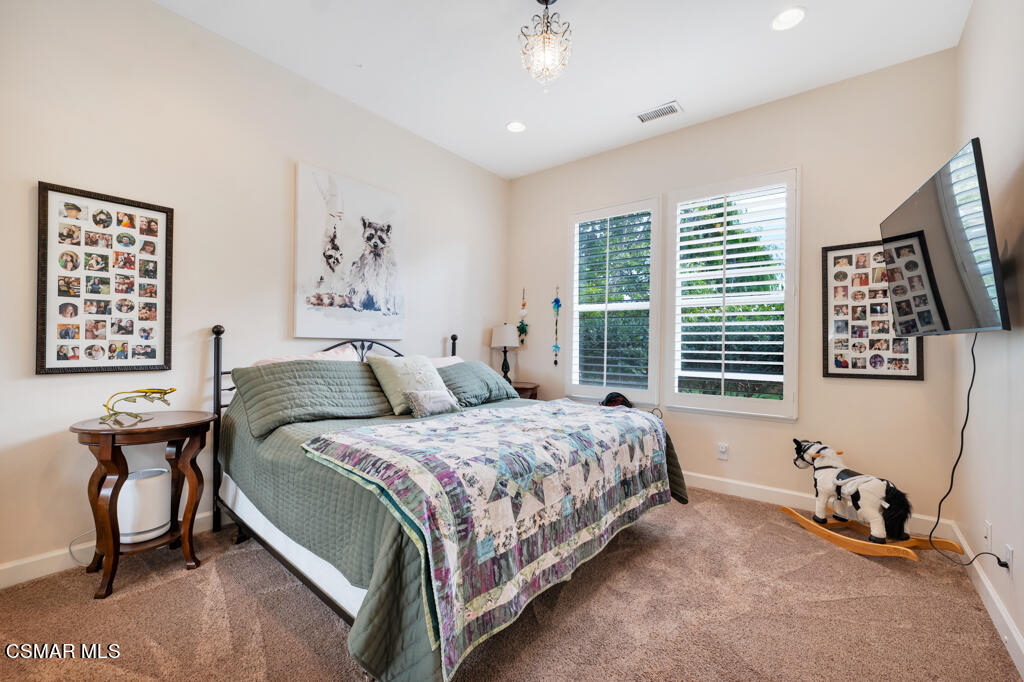 1776 Corte Jubilo Camarillo, CA 93012 - Photo 38 of 74 a spacious bedroom with a bed and a table in it