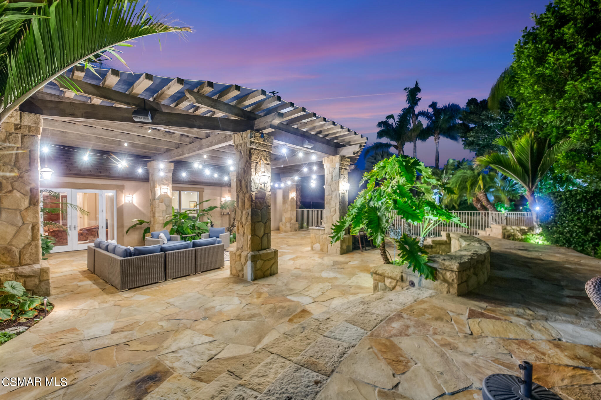 1776 Corte Jubilo Camarillo, CA 93012 - Photo 59 of 74 a view of a patio with couches and table and chairs and potted plants
