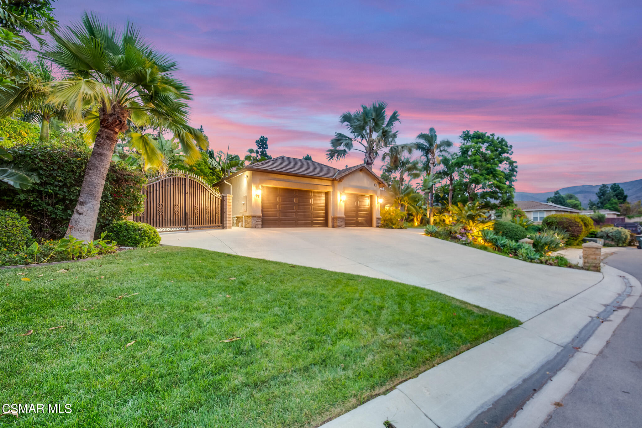 1776 Corte Jubilo Camarillo, CA 93012 - Photo 71 of 74 a front view of a house with a yard and garage