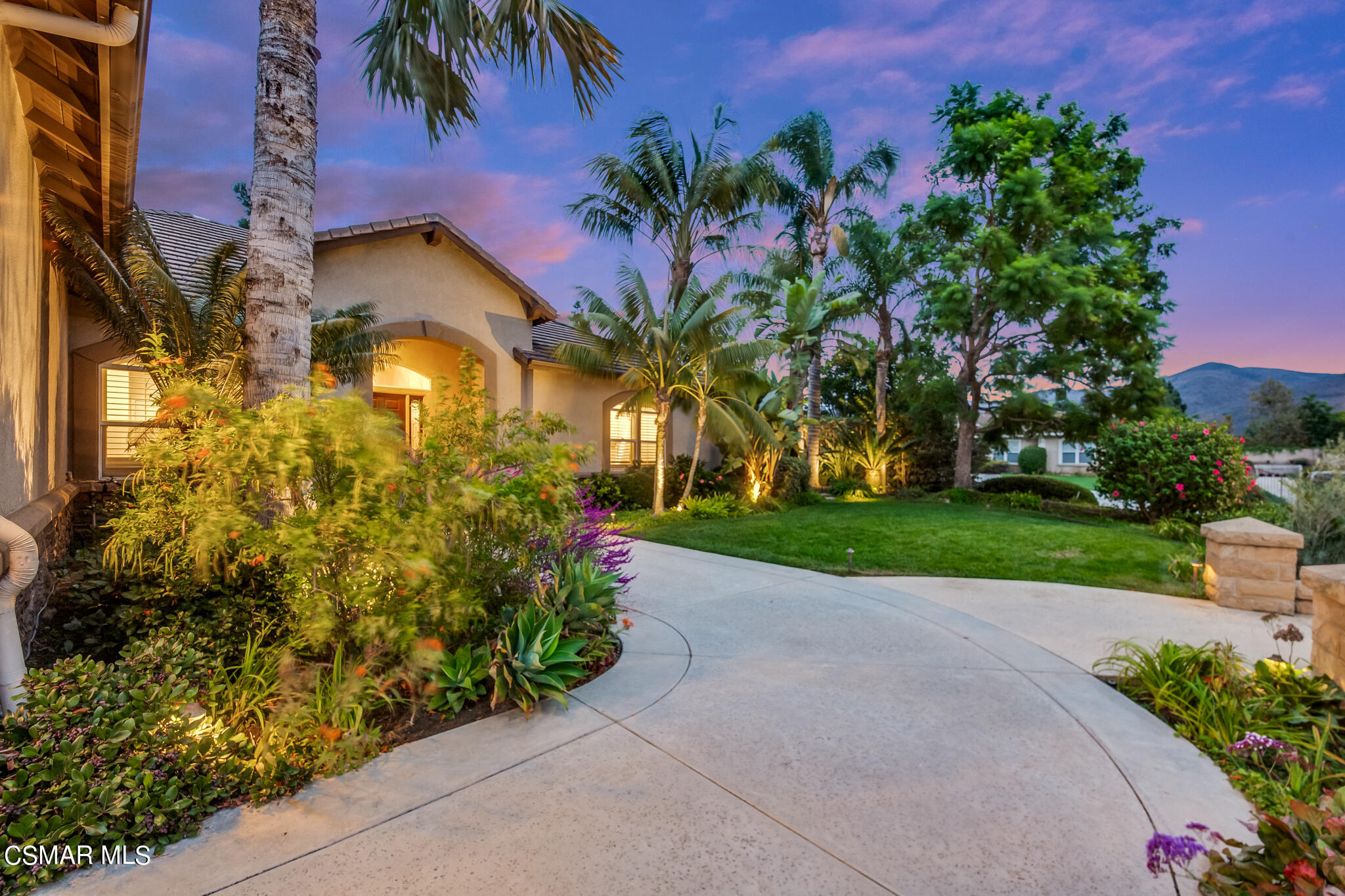 1776 Corte Jubilo Camarillo, CA 93012 - Photo 72 of 74 a front view of a house with a yard and a garage
