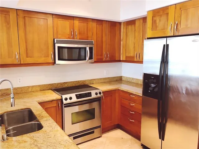a kitchen with a sink and a microwave