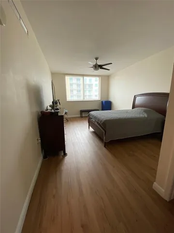 a living room with a bed furniture and a window