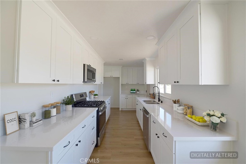 18190 Hiawatha Road Apple Valley, CA 92307 - Photo 8 of 28 Remodeled Kitchen (Disclaimer: Some images have been digitally enhanced with virtual staging to illustrate potential room layouts and furnishings. Actual property condition and features may vary. Buyer to verify all information independently).