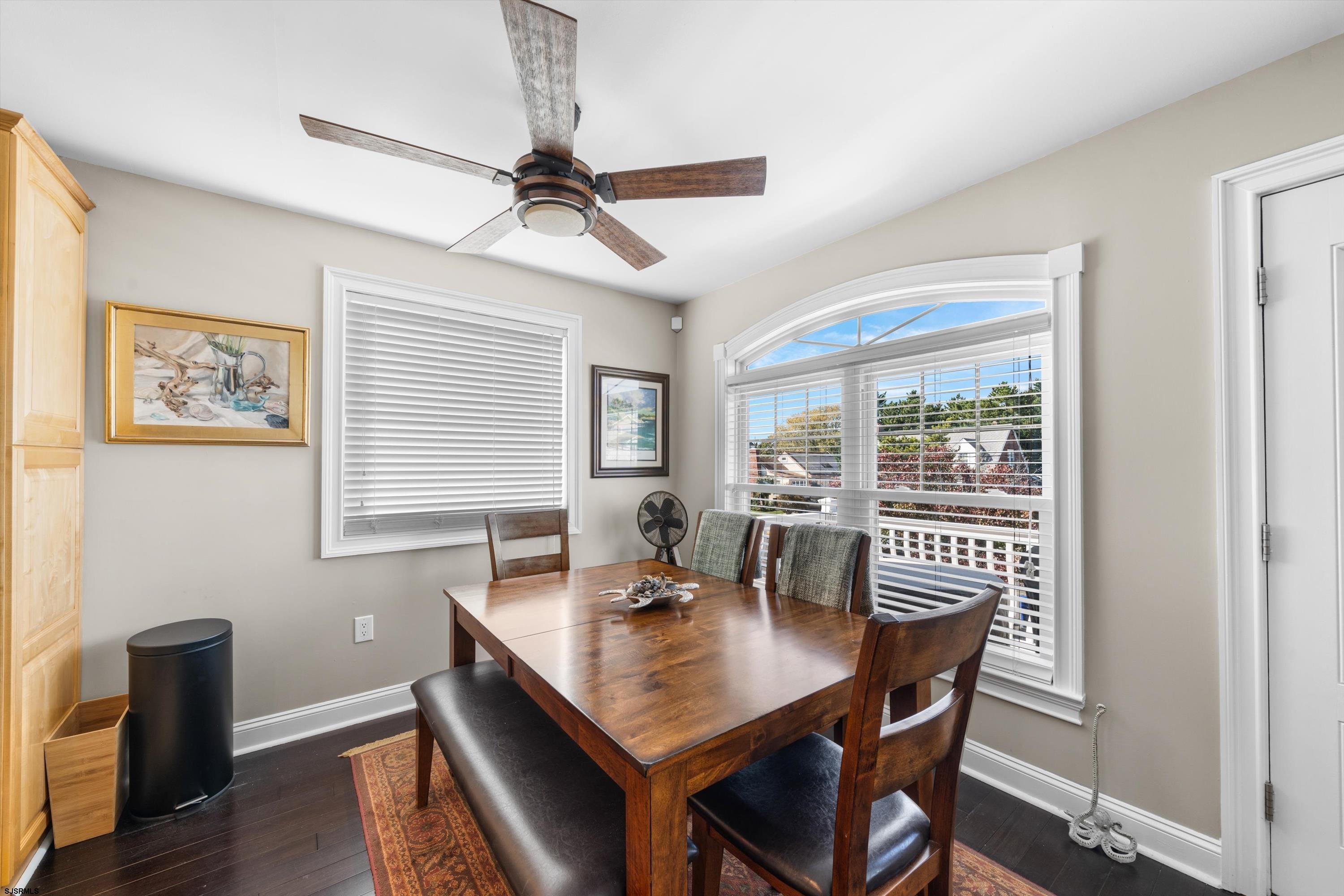 51 Simpson Road, Unit 2 Ocean City, NJ 08226 - Photo 14 of 43 a view of a dining room with furniture window and wooden floor