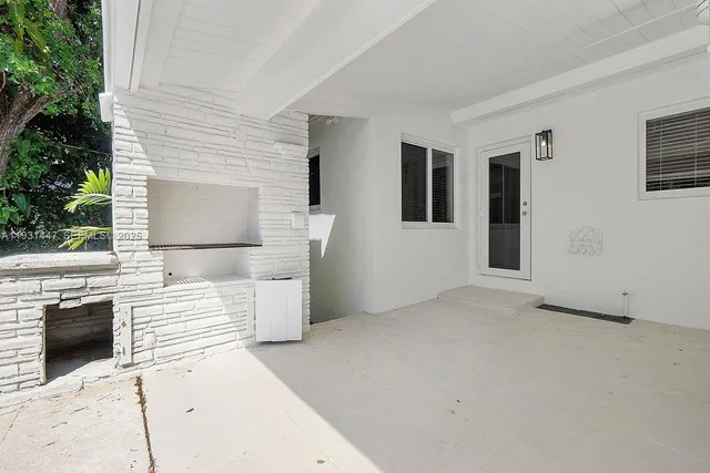 a view of a hallway with washer and dryer