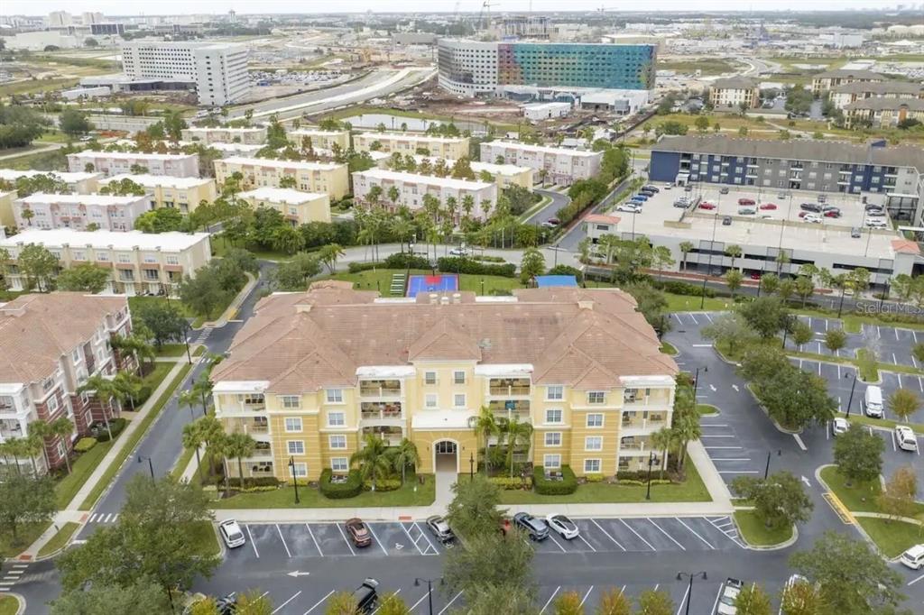5025 Shoreway Loop, Unit 10703 Orlando, FL 32819 - Photo 2 of 53 an aerial view of residential houses with outdoor space