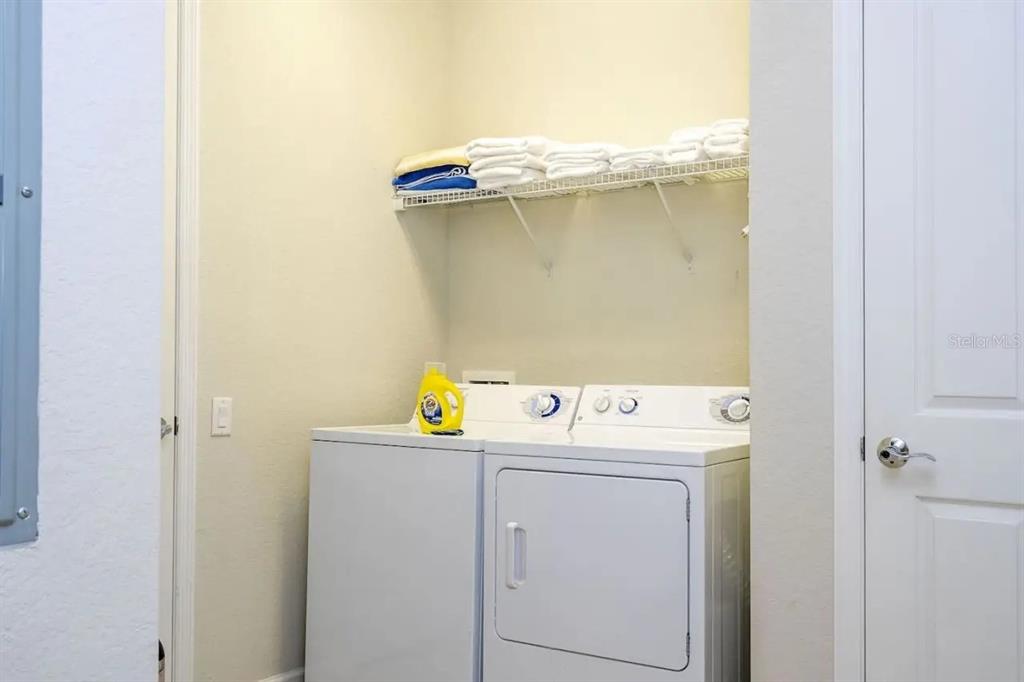 5025 Shoreway Loop, Unit 10703 Orlando, FL 32819 - Photo 21 of 53 a utility room with dryer and washer