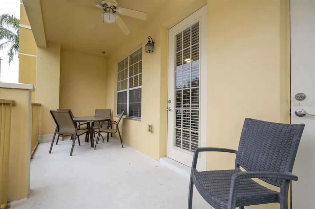 5025 Shoreway Loop, Unit 10703 Orlando, FL 32819 - Photo 24 of 53 a dining room with furniture and window