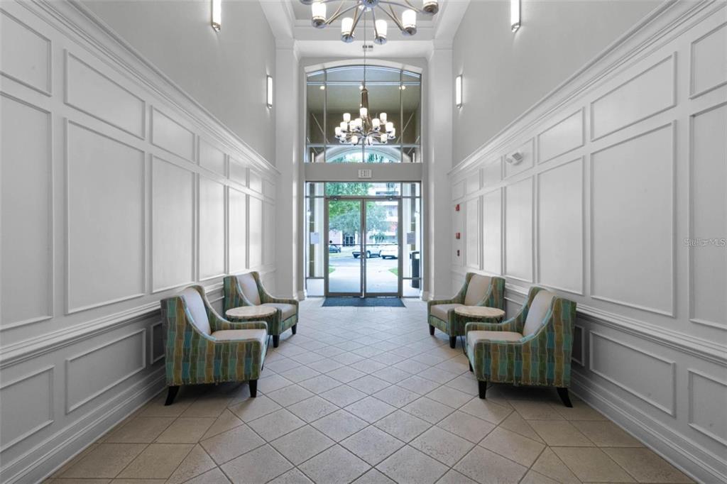 5025 Shoreway Loop, Unit 10703 Orlando, FL 32819 - Photo 25 of 53 a lobby room with furniture and windows