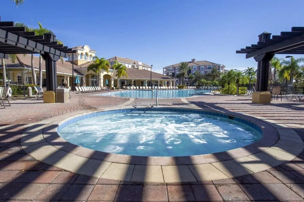 5025 Shoreway Loop, Unit 10703 Orlando, FL 32819 - Photo 42 of 53 a view of a yard and front view of a building