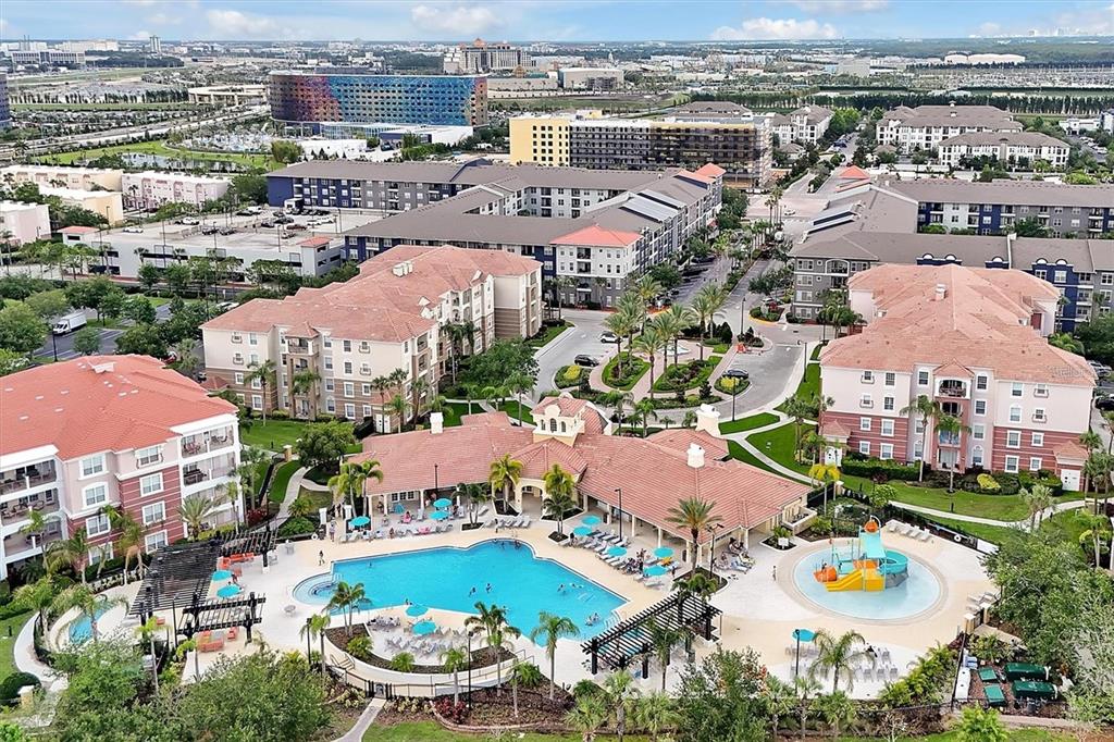 5025 Shoreway Loop, Unit 10703 Orlando, FL 32819 - Photo 50 of 53 an aerial view of residential houses with outdoor space